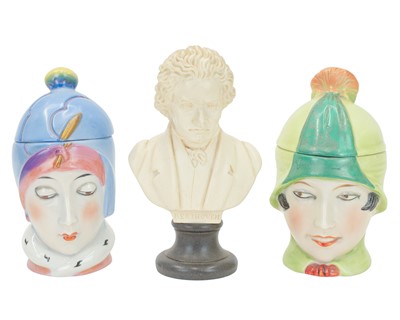 Lot 214 - Two continental Art Deco bonbonnieres in the form of ladies' heads.