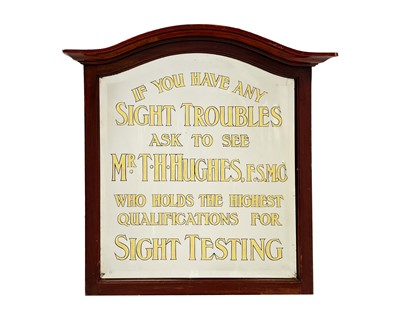 Lot 529 - A framed opticians advertising mirror.