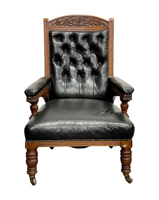 Lot 928 - A late Victorian leather upholstered oak armchair.