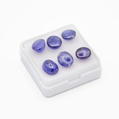 Lot 65 - A parcel of six cabochon glass-filled and heat-treated loose sapphires.