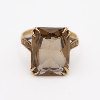 Lot 68 - A 9k hallmarked gold smokey quartz set cocktail ring.