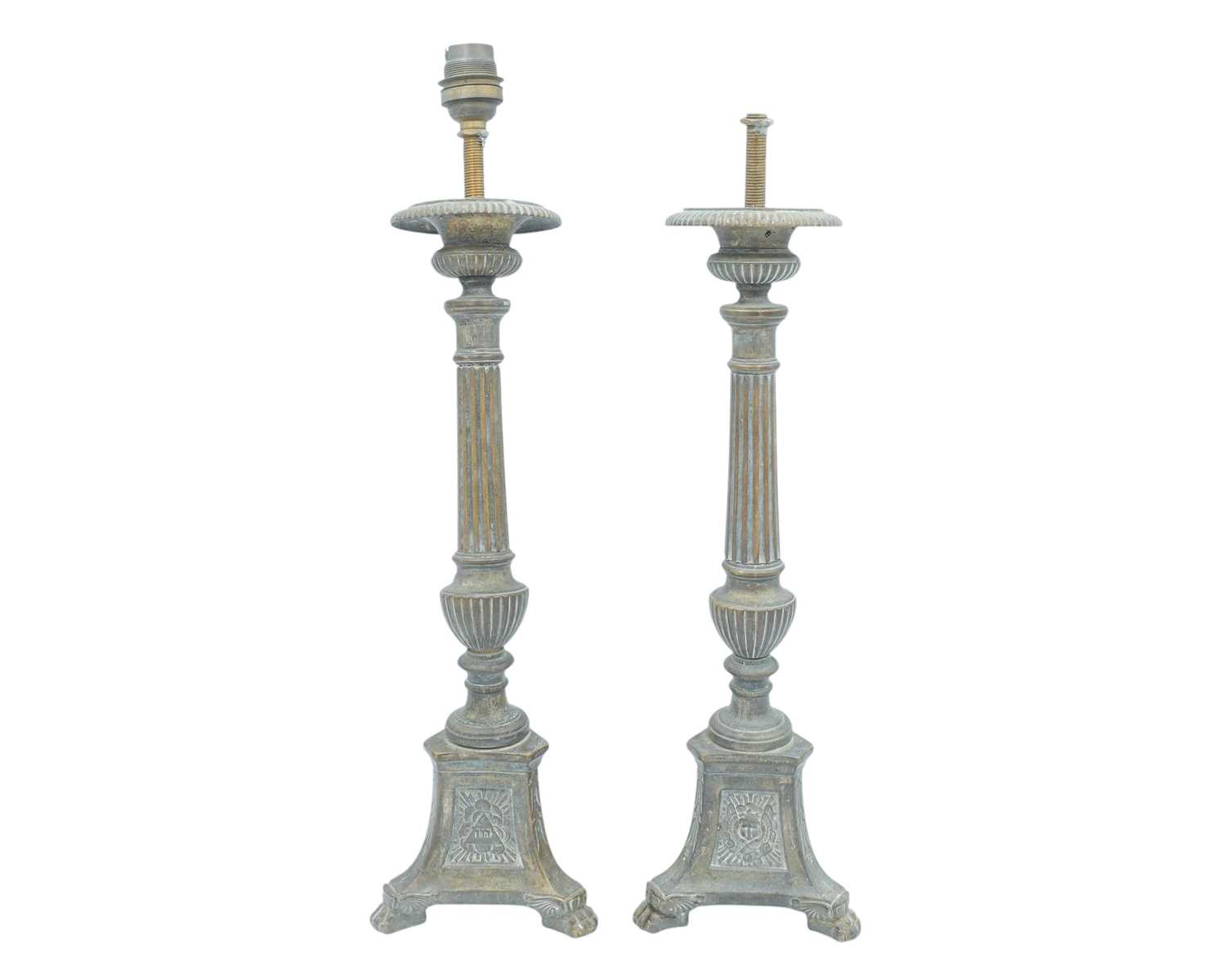 Lot 103 - A pair of ecclesiastical brass candlesticks.