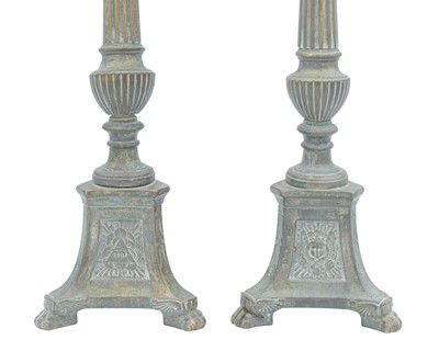 Lot 103 - A pair of ecclesiastical brass candlesticks.