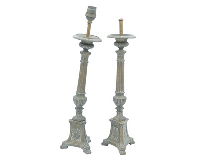 Lot 103 - A pair of ecclesiastical brass candlesticks.
