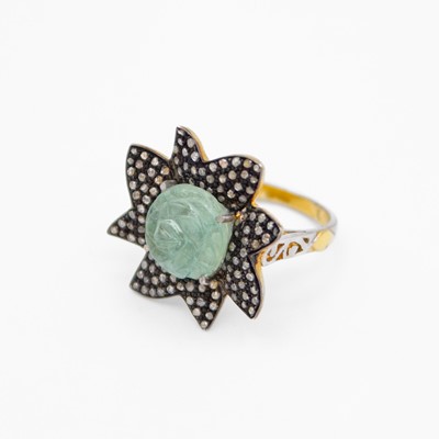 Lot 71 - A silver-gilt ring set with a carved aquamarine and rose-cut diamonds.