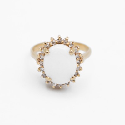 Lot 73 - A 14k oval white opal and diamond cluster ring.
