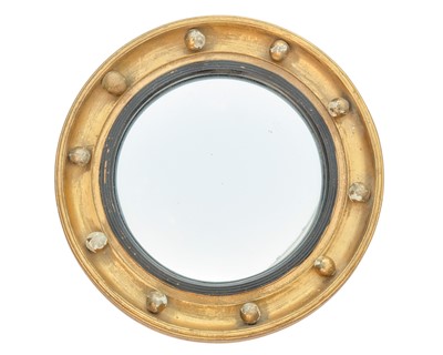 Lot 520 - A 19th century giltwood convex mirror.