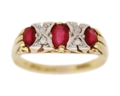 Lot 215 - An 18k and platinum red paste and diamond set ring.