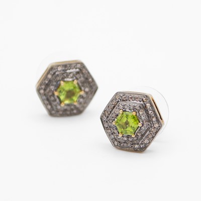 Lot 118 - A pair of silver-gilt hexagonal peridot and diamond set stud earrings.