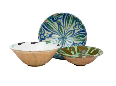 Lot 618 - Three Spanish pottery bowls.