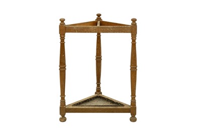 Lot 703 - A late Victorian oak corner stick stand.