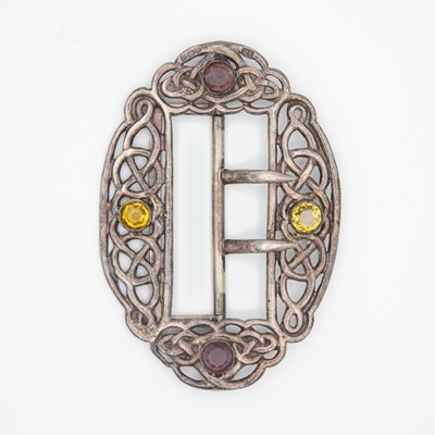 Lot 83 - An Edwardian silver Celtic knot design buckle set with amethyst and citrine by Lawrence Emanuel.