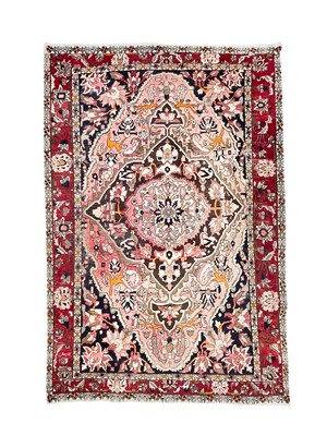 Lot 472 - A Tabriz carpet.