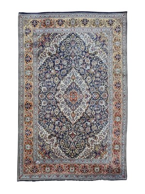 Lot 487 - A Persian Kashan carpet.