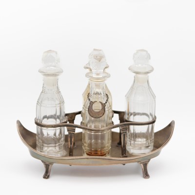 Lot 98 - A George III silver four-bottle cruet by Robert Hennell.