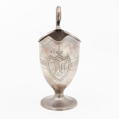 Lot A George III silver helmet cream jug.