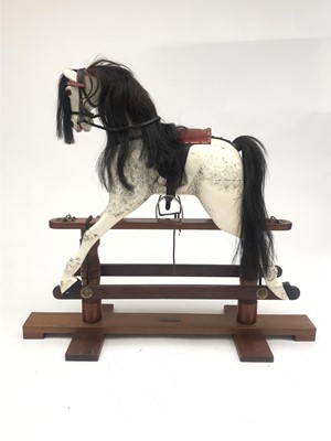 Lot 330 - A carved and painted rocking horse, late 20th...