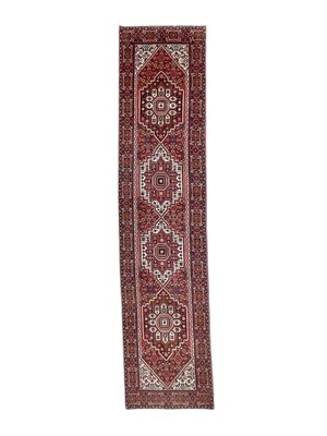 Lot 466 - A Persian runner.