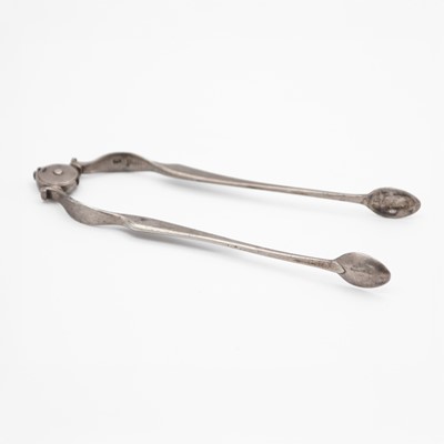 Lot 109 - A pair of George III sprung silver sugar tongs by William Bennett.