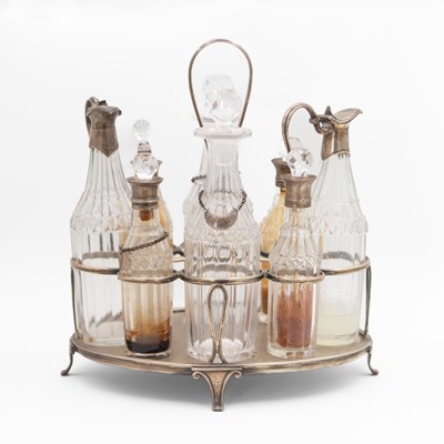 Lot 112 - A George III silver eight-bottle cruet stand by Robert Hennell I & David Hennell II.