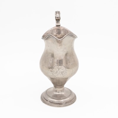 Lot 115 - A George III silver helmet form cream jug by Robert Hennell I.