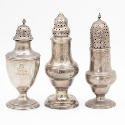 Lot 119 - Two George III silver muffineers by Robert Hennell I, and one other.