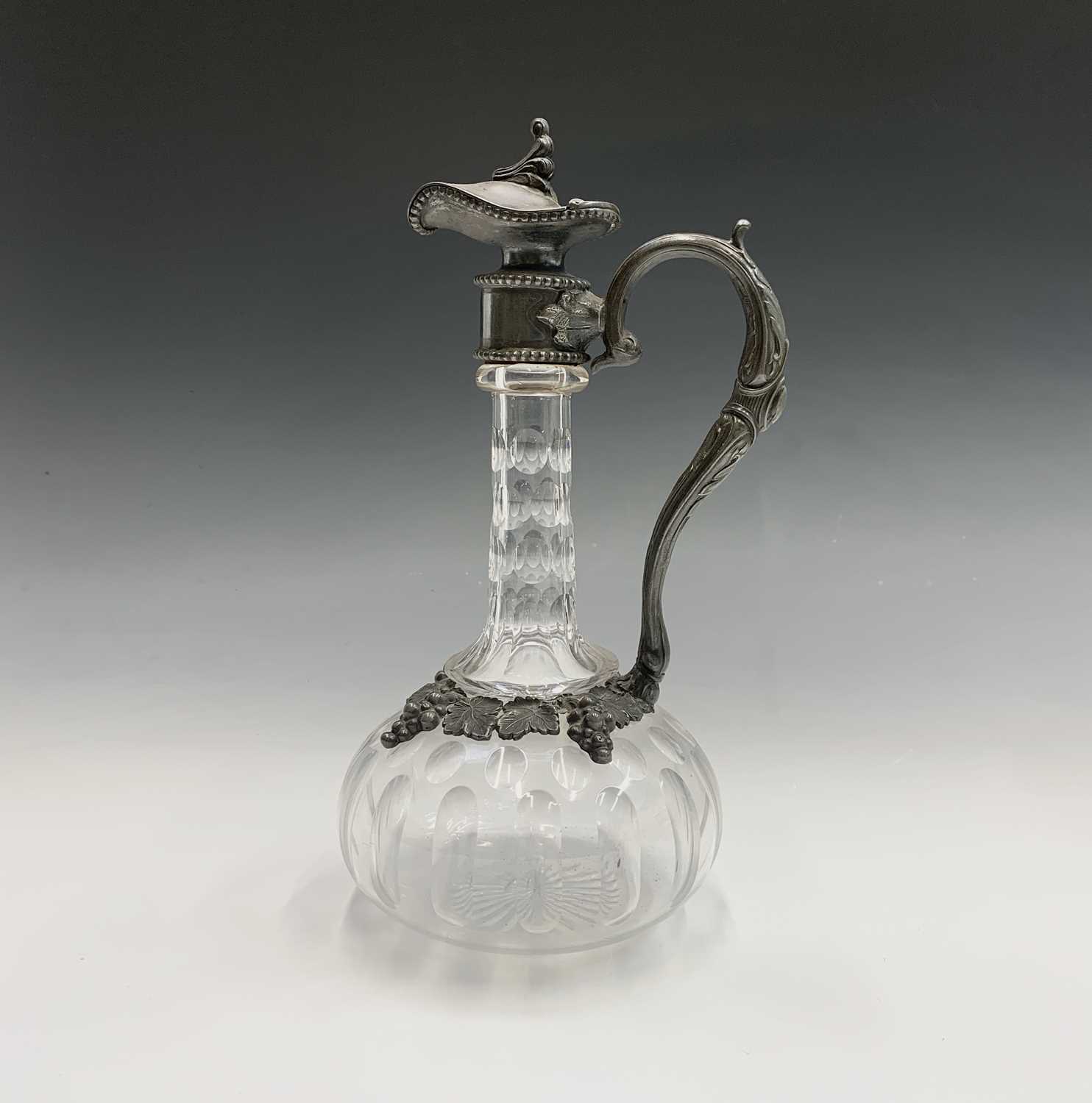 Lot 924 - A Victorian glass claret jug with ornate EPBM...