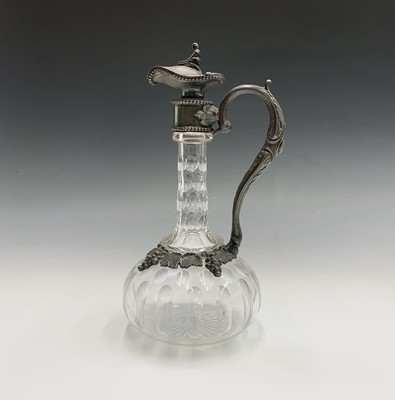 Lot 924 - A Victorian glass claret jug with ornate EPBM...