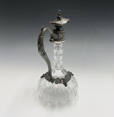 Lot 924 - A Victorian glass claret jug with ornate EPBM...