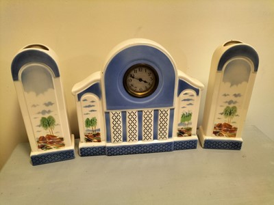 Lot 320 - A clock garniture