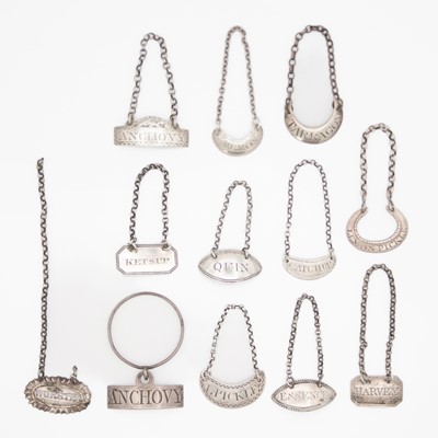 Lot 141 - A collection of twelve 18th & 19th-century silver sauce labels by various makers.