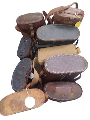 Lot 68 - A collection of eleven cased binoculars, including some military.
