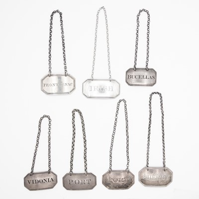 Lot 144 - A collection of seven Georgian silver rectangular canted wine labels.