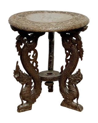 Lot 412 - An Eastern carved hardwood circular table.
