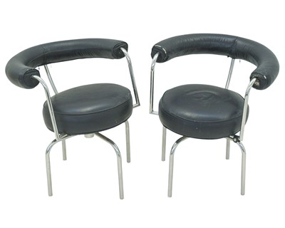 Lot 635 - After Le Corbusier - a pair of LC7 style swivel chairs.