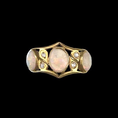 Lot 164 - A high purity gold (tests 18ct) white opal and small diamond seven stone ring.