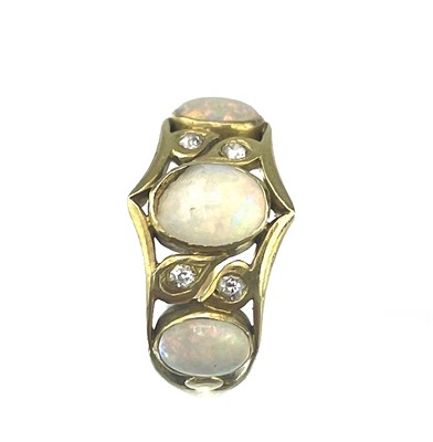 Lot 164 - A high purity gold (tests 18ct) white opal and small diamond seven stone ring.