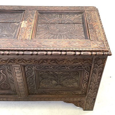 Lot 92 - A carved oak joined chest, substantially 17th century.