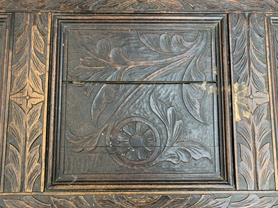 Lot 92 - A carved oak joined chest, substantially 17th century.