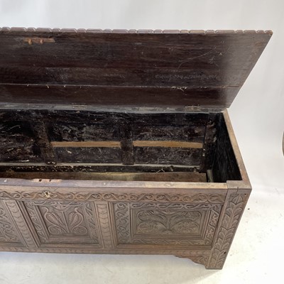 Lot 92 - A carved oak joined chest, substantially 17th century.