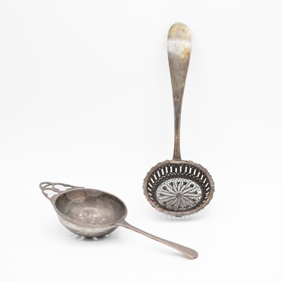 Lot 160 - A George VI silver tea strainer and an 18th-century continental white metal filigree powder spoon