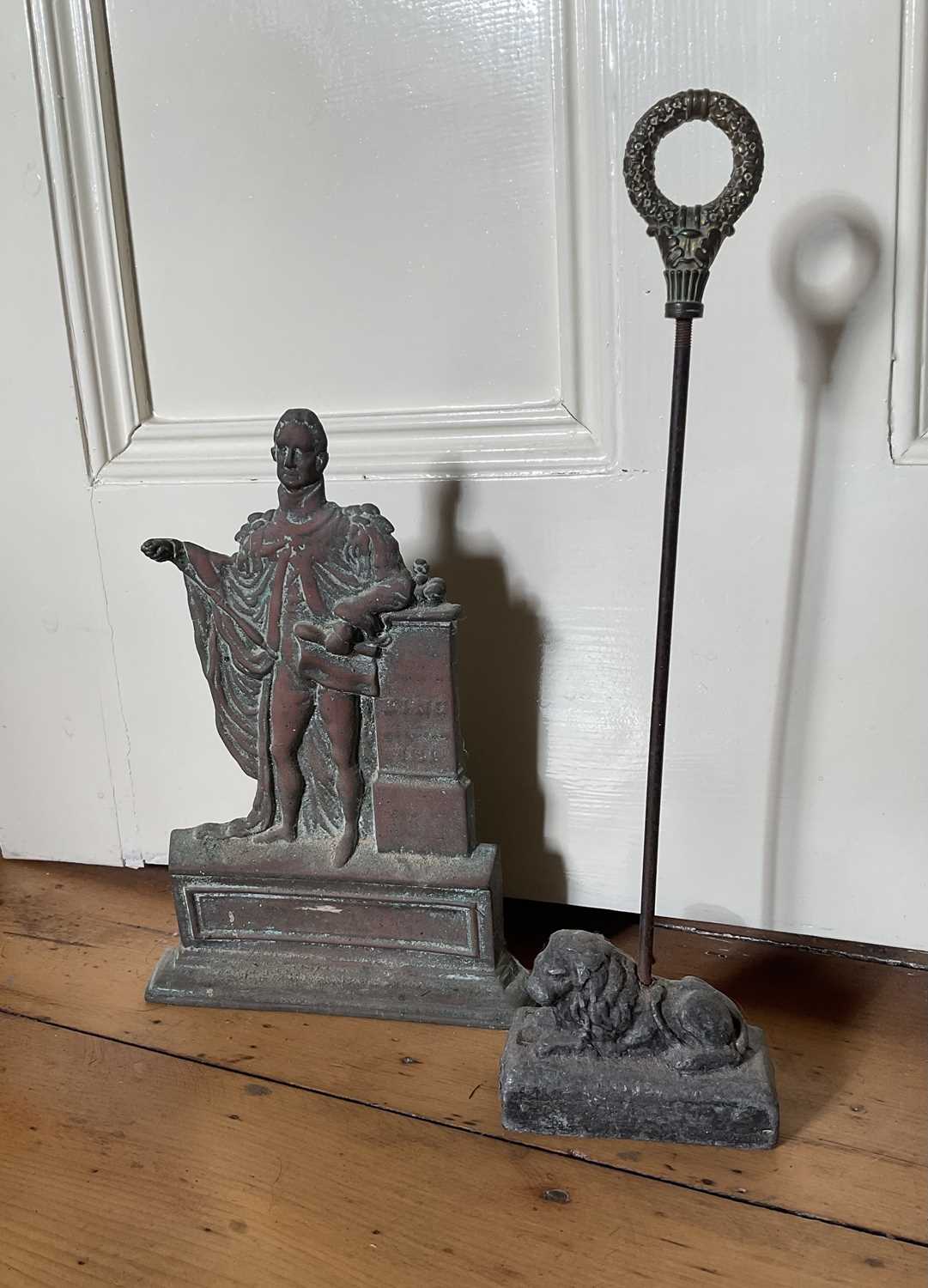 Lot 24 - King William IV cast brass doorstop