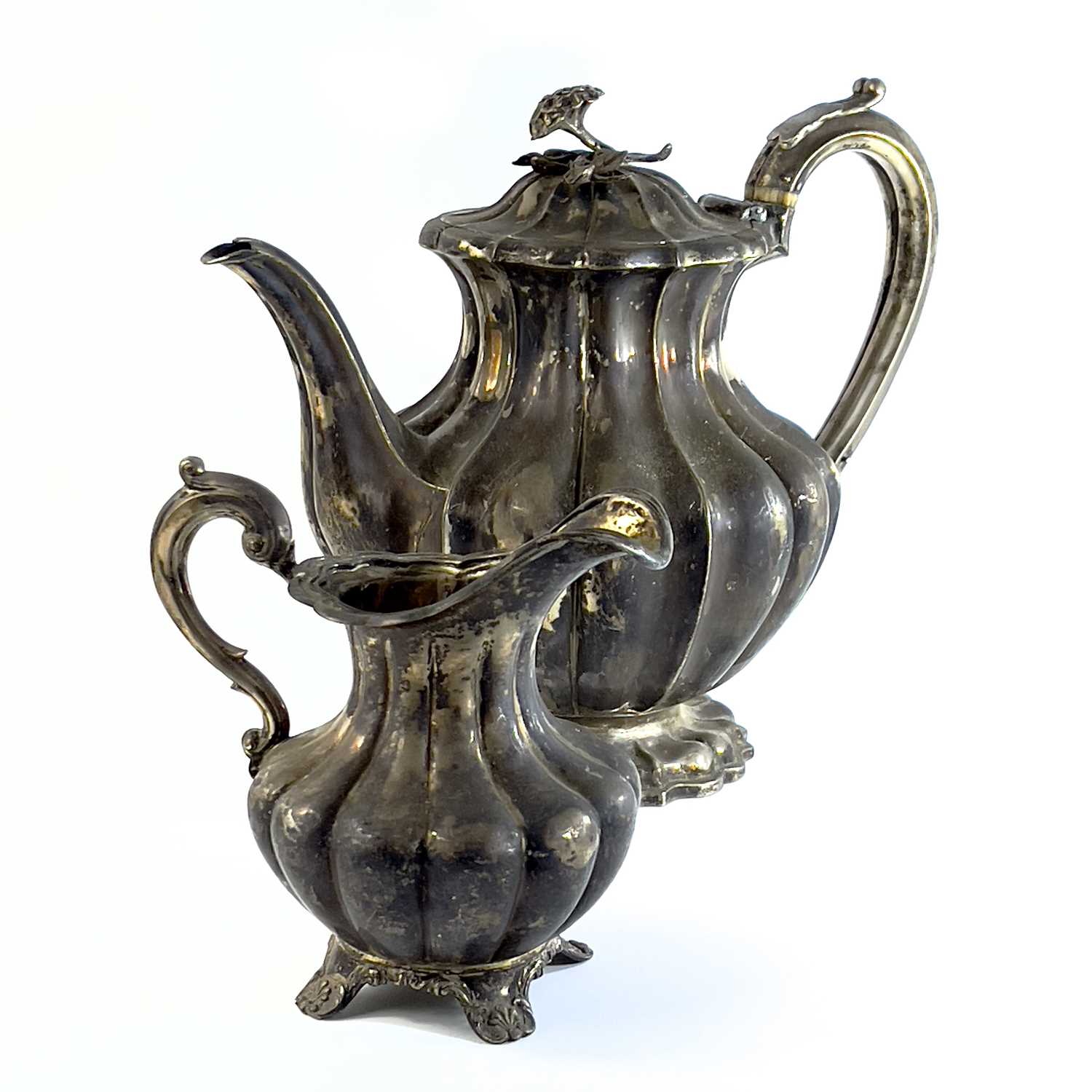 Lot 281 - A George IV silver pear shape teapot with flower finial by Richard Pearce & George Burrows