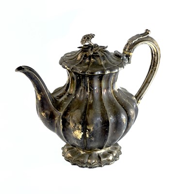 Lot 281 - A George IV silver pear shape teapot with flower finial by Richard Pearce & George Burrows