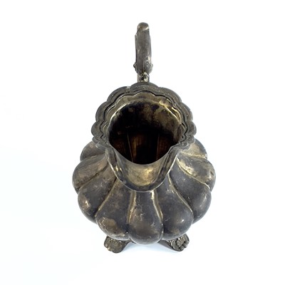 Lot 281 - A George IV silver pear shape teapot with flower finial by Richard Pearce & George Burrows