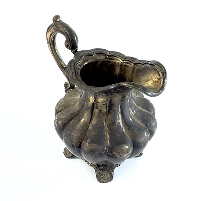 Lot 281 - A George IV silver pear shape teapot with flower finial by Richard Pearce & George Burrows