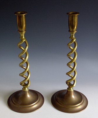 Lot 242 - A pair of brass candlesticks with twisted...