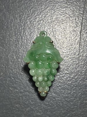 Lot 3 - An Art Deco rose gold green jadeite set dress clip.