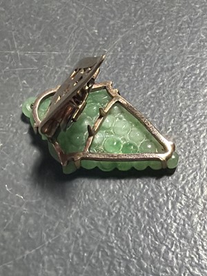 Lot 3 - An Art Deco rose gold green jadeite set dress clip.