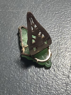 Lot 3 - An Art Deco rose gold green jadeite set dress clip.